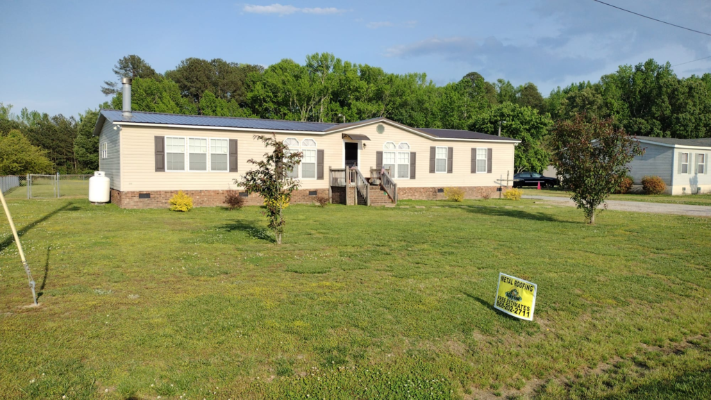 An image of a house with a metal roof