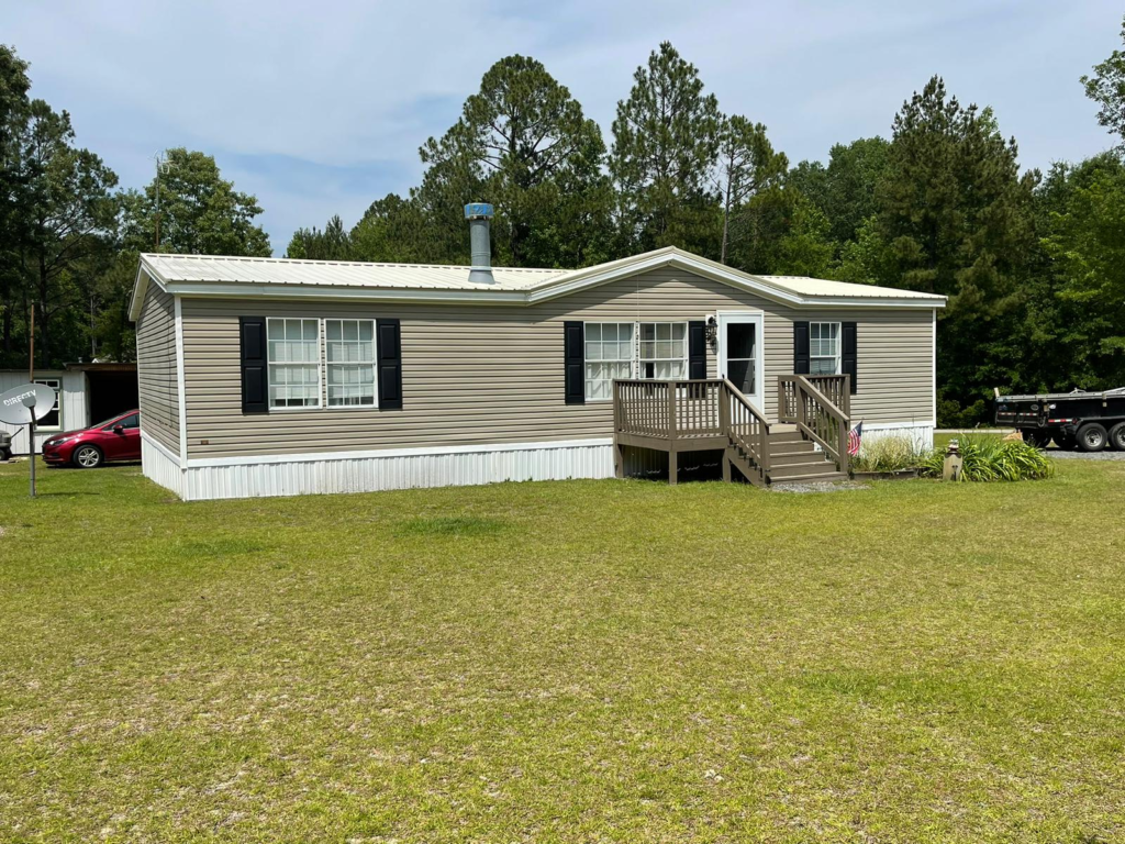 An image of a house with a metal roof